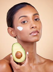 Image showing Avocado, cream and skincare with portrait of woman in studio for product, beauty and natural cosmetics. Spa, facial and lotion with face of model on brown background for vitamin c and self care