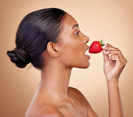 Image showing Woman, strawberry and skincare with natural beauty or benefits from healthy nutrition, diet and eating fruit. Girl, profile and food with vitamin c for skin to glow, shine or wellness of body