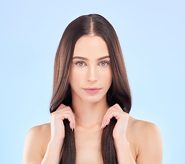 Image showing Portrait, texture and woman with hair care, cosmetics and wellness on a blue studio background. Female person, aesthetic or model with volume, natural beauty and luxury with self care and dermatology