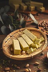 Image showing White chocolate cubes with pistachios