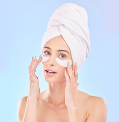 Image showing Beauty, eye pads and portrait of woman in studio for natural, health and wellness routine. Skincare, cosmetic and young female model from Australia with a clean skin treatment by a blue background.