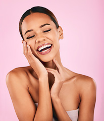 Image showing Funny, smile and woman with skincare, beauty and dermatology against a pink studio background. Female person, humor or happy model with makeup, wellness and facial with luxury, laughing and aesthetic