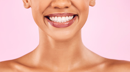 Image showing Woman, teeth and smile, beauty and dental with shine on lips, oral health and veneers isolated on pink background. Female model, orthodontics and wellness, cosmetics and closeup of mouth in studio