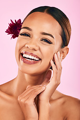 Image showing Natural beauty, flower and portrait of woman with cosmetics, wellness and skin care glow on pink background. Makeup, organic dermatology and model with luxury facial care and healthy spa in studio.