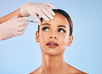 Image showing Eyebrow, injection and beauty, woman and cosmetic surgery and dermatology isolated on blue background. Face, skincare and syringe, female model and doctor hands with liquid collagen in studio