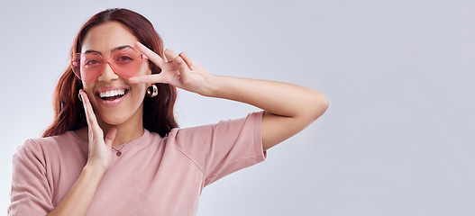 Image showing Fashion sunglasses, portrait or happy woman with banner, smile or retro style isolated on white background. Mockup space, smile or cool gen z girl model with funky style or peace sign in studio