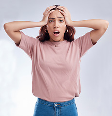 Image showing Woman with hands on head, surprise and stress, reaction in portrait with disaster isolated on white background. Crisis, mistake and fail, female person with problem and wow expression in a studio