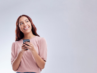 Image showing Phone or mockup or happy woman on social media thinking of online dating or chat website for texting. Smile, banner space ideas or gen z female typing on mobile isolated on studio white background