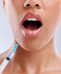 Image showing Lip filler, injection and beauty, woman with surprise and cosmetic surgery closeup on white background. Skincare, liquid collagen and female model with wow face, mouth and syringe with dermatology