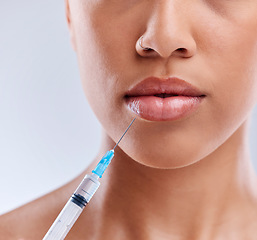 Image showing Lip filler, injection and beauty, woman and cosmetic surgery with face closeup isolated on white background. Skincare, liquid collagen and female model, skin and syringe with dermatology in studio