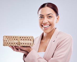 Image showing Gift, smile and portrait of business woman in studio for shopping, surprise and birthday mockup. Wow, giveaway and prize with face of person and box on white background for package and present