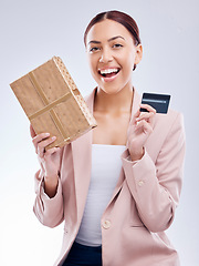 Image showing Gift, portrait and happy woman with credit card in studio, wow and smile for cashback gift on grey background. Customer, reward and female face with box present promotion for retail, sale or payment