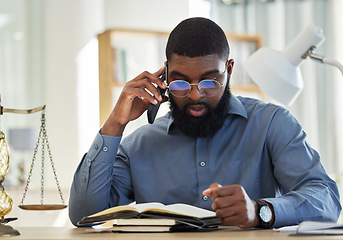 Image showing Phone call, reading and notebook with a black man lawyer reading information for a legal case or trial. Mobile, communication and research with a male attorney in his office learning about the law