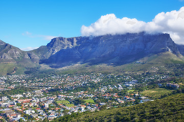 Image showing Beautiful scene of table Mountain in Cape Town on a sunny day with copy space. View of a bright sky and cloud with cityscape in South Africa. Serene harmony in nature and peaceful landscape views