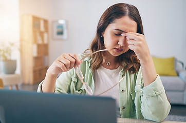 Image showing Headache, stress and woman on laptop in home with deadline for project, report and online task. Remote work, overworked and female person with burnout, frustrated and worry for freelance business