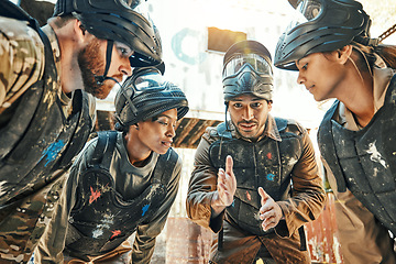 Image showing Paintball team, meeting and idea for game plan, collaboration or strategy on the battle field together. Group of paintballers in war discussion, teamwork or speech for motivation before match start