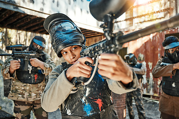 Image showing Paintball team, gun and woman aim, focus and shooting at target practice, competition or military conflict, fight or mission. Group, soldier or people point weapon in survival war, training or battle