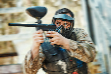 Image showing Paintball gun, focus and man aim, shooting and target soldier, action warrior or training for battlefield fight conflict. Army mission gear, blur and male shooter in war, battle or military practice