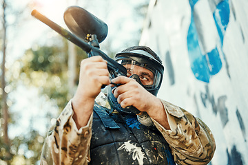 Image showing Paintball gun, gear and man aim, shooting and target soldier, warrior or training competition for battlefield fight, conflict or challenge. Army mission, male shooter and military focus on war battle