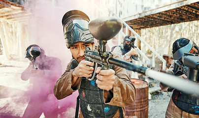 Image showing Teamwork, smoke and paintball with man in game for playground, war and sports gaming. Challenge, mission and soldier with people shooting in battlefield arena for target, gun and warrior training