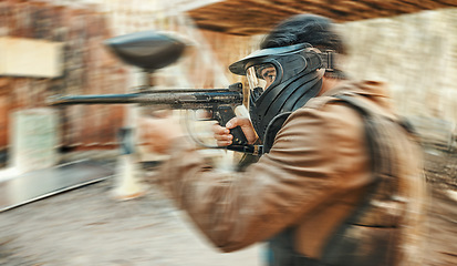 Image showing Paintball, sports and man in action blur with gun for tournament, competition and battle. Target, soldier and person shooting in outdoor battlefield arena for training, adventure game or challenge