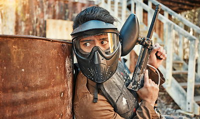 Image showing Paintball, adventure and man in action with gun for tournament, competition and battle in nature. Extreme sports, military and male person shooting in outdoor arena for training, games and challenge