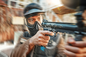 Image showing Paintball, blur and man in action with gun for tournament, competition and battle in nature. Camouflage, sports and male person shooting in outdoor arena for training, adventure games and challenge