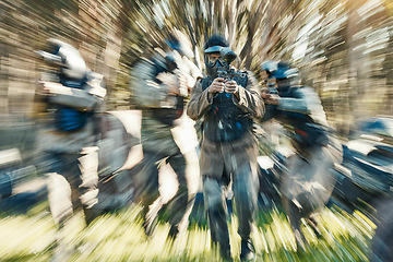 Image showing Fast, sports and paintball with man in game for playground, motion blur and gaming. Challenge, mission and soldier action with people shooting in battlefield arena for target, gun or warrior training