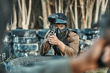 Image showing Paintball gun, opponent or man aim, shooting and target soldier, warrior or action player in battlefield arena. Army mission, male shooter or military focus on war battle, conflict fight or challenge