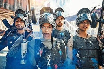 Image showing Paintball, focus and portrait of team or people ready for a battle and teamwork or collaboration together. Serious, sports and army on a mission on the battlefield with guns for outdoor competition