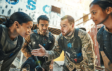 Image showing Paintball game, group strategy and team planning, discussion or battlefield conversation about military mission. Teamwork, huddle and diversity people talk about plan, battle or brainstorming tactics