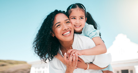 Image showing Hug, piggyback and mom with her girl child playing outdoor in the garden at their family home. Happy, smile and young mother carrying her kid on her back bonding and playing together in the backyard.