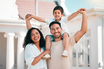 Image showing Happy, love and portrait of a family in the backyard for outdoor fresh air by their modern house. Happiness, smile and boy child bonding and posing with his parents in the garden by their home.