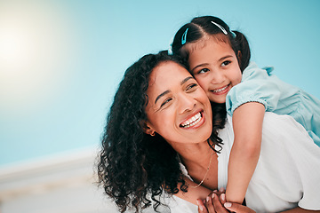 Image showing Love, piggyback and mother with her girl child in the outdoor garden at their family home. Happy, smile and young mom carrying her kid on his back while bonding and playing together in the backyard.