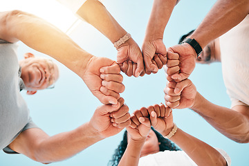 Image showing Fist bump, hands and business people with support on sky background for teamwork, solidarity or low angle commitment. V, sign and team power sign in collaboration, partnership or goal motivation