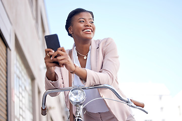 Image showing Happy business woman in city with bike, phone and morning commute, checking location or social media. Eco friendly transport bicycle, cycling and African girl with mobile app, smile and work travel.