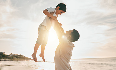 Image showing Beach, love and father lifting boy child with freedom, smile and travel celebration in nature. Flying, fun and parent with kid at the ocean for bond, happy and airplane game while traveling in Bali