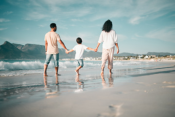 Image showing Holding hands, walking and family and the beach from behind with freedom, vacation and fun at the sea. Ocean, back and boy child together with parents in Mexico for travel, bond or summer holiday