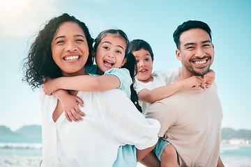 Image showing Family, parents piggyback children on beach and bonding with travel to Mexico, portrait and smile. Happiness, man and woman with kids outdoor, love and trust with hug while on tropical holiday