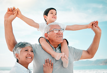 Image showing Beach, family and child on grandfather shoulder with grandmother outdoor, love and bond on holiday. Summer, happiness and people in nature, tropical vacation in Mexico with old man, woman and boy kid