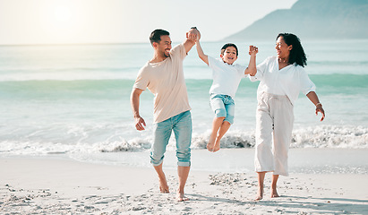 Image showing Holding hands, dad or mother playing child at beach with a happy family for holiday vacation travel in nature. Jump, parents or mom lifting child with dad walking at sea or ocean bonding together