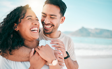 Image showing Love, happy and travel with couple on beach for lens flare, summer and vacation together. Peace, smile and relax with man and woman hugging on date for seaside holiday, care and mockup space