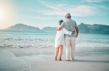Image showing Back, hug or old couple on beach to relax with love, care or support on summer vacation in nature. Retirement, mature man or senior woman at sea or ocean to travel on holiday together looking at view