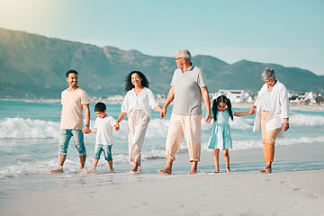 Image showing Generations, holding hands and walking family on beach and ocean waves, freedom and bonding in nature. Grandparents, parents and kids, people outdoor and travel with trust and love on Mexican holiday