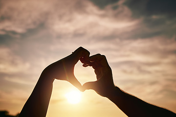 Image showing Heart hands, sunset on beach and silhouette with love and romance sign, people travel and outdoor. Adventure, emoji and care with health in nature, support and commitment, couple with trust and sea