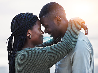 Image showing Couple, beach and touch forehead outdoor for love, care and commitment. Profile of a young black man and a happy woman together on a romantic vacation, holiday or sunset travel adventure in Jamaica