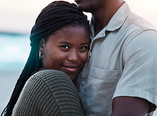 Image showing Black couple, hug and portrait outdoor at beach with love, care and commitment or security. Smile on face of young african woman and man together on vacation, holiday or travel adventure in Jamaica