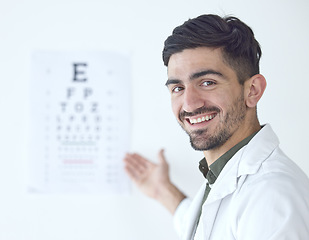 Image showing Portrait of man, doctor and eye exam with smile in clinic or vision and eyesight in medical office. Professional healthcare, wellness and happy expert optician, reading test for eyes health and sight