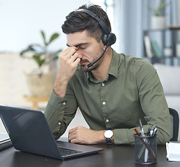 Image showing Man, laptop and headache in call center, stress or debt in customer service or support at the office. Male person, consultant or agent with headphones and bad head pain in burnout at the workplace