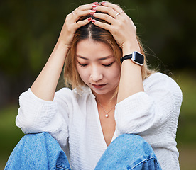 Image showing Sad, depression and a woman in a park with a mistake, thinking and anxiety. Tired, idea and a girl or person in a garden or field with fear, anger or depressed about a problem, fail or memory